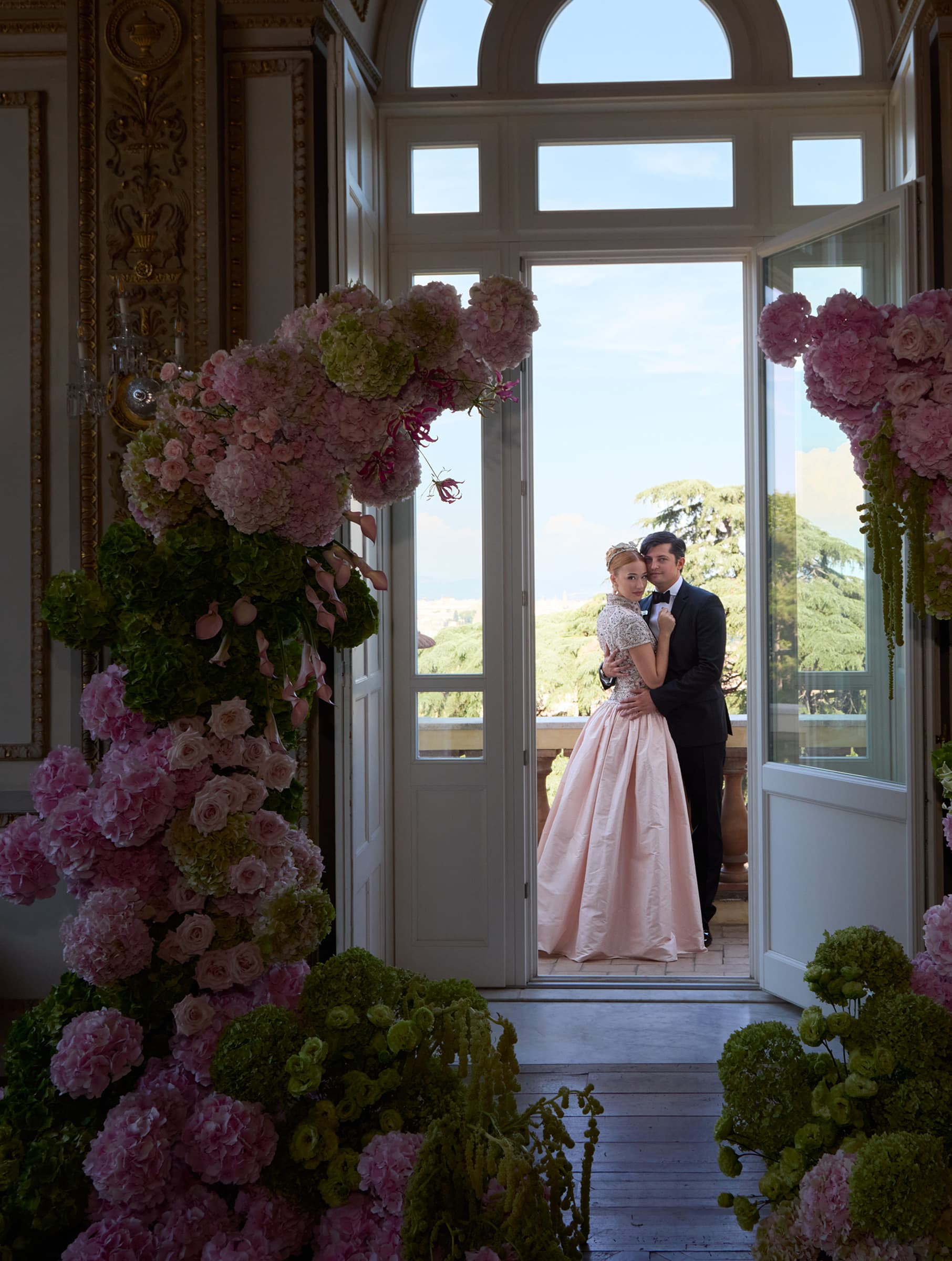 Alaia and Marian beside the flower-framed window at Villa Aurelia in Rome